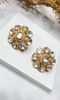 Embrace the timeless beauty of traditional Indian jewelry with our "Timeless Beauty" Uncut Kundan Polki Stud Earrings, meticulously crafted in brass. These stud earrings pay homage to the opulence of uncut Kundan and the rich heritage of Indian craftsmanship. They are the perfect choice for adding a touch of traditional elegance to your attire, whether it's for weddings, special occasions, or cultural celebrations. Materials: Brass: The earrings are skillfully made from brass, reflecting the dep Temple Jewelry Bridal Earrings With Mirror Work For Diwali, Temple Jewelry Earrings With Mirror Work For Wedding, Gold Temple Jewelry Bridal Earrings With Mirror Work, Gold Bridal Earrings With Mirror Work In Temple Style, Elegant Gota Work Earrings For Navratri, Gold Temple Bridal Earrings With Mirror Work, Gold Earrings With Mirror Work For Navratri, Temple Jewelry Earrings With Mirror Work For Celebration, Festive Temple Jewelry Earrings With Mirror Work