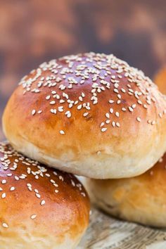 three sesame seed bagels stacked on top of each other