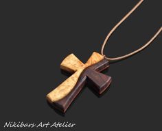 a wooden cross is shown on a black background