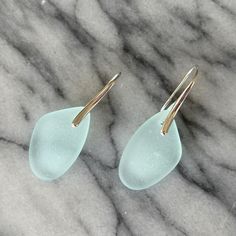 1.75" Long X .60" Diameter 925 Sterling Silver Polished Earhook. Super Light And Comfortable. Light Aqua Seafoam Recycled Tumbled Glass. Mahalo For Shopping! Aqua Earrings, Coke Bottle, Mini Hoop Earrings, Glitter Earrings, Glass Light, Light Aqua, Beaded Drop Earrings, Cz Earrings, Green Earrings