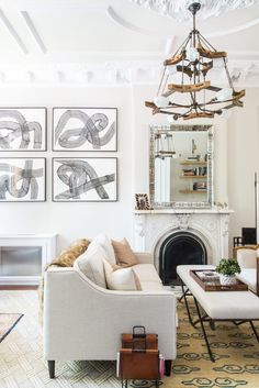 the living room is decorated in white and has pictures on the wall above it with text overlay that reads how to decorate a room from scratch