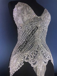 Rhinestone and crystal bodice applique Luxury Embellished Fitted Top, Glamorous Fitted Bedazzled Tops, Glamorous Bedazzled Fitted Tops, Glamorous Silver Top With Rhinestones, Silver Rhinestone Evening Top, Glamorous White Tops With Rhinestones, Fitted Rhinestone Tops For Wedding, Glamorous Beaded Tops For Wedding, Elegant Bedazzled Tops For Evening