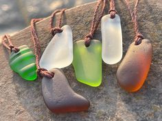 Sea glass necklaces. Reclaimed from the ocean, drilled and made into something new and beautiful. An eco friendly gift for yourself or a loved one.  I have hung them on sustainable hemp. The cord has been left loose so you can tie at your preferred length.  The pendant will arrive in a smart recycled gift box.  If purchasing as a present, recycled handmade cards are also available in my shop. I would be happy to add a message of your choice if you wish me to post direct.  Lynda - EcoOctopus 💚 h Minimalist Handmade Necklaces With Recycled Glass, Minimalist Handmade Necklace With Recycled Glass, Unique Recycled Glass Necklaces For Beach, Unique Recycled Glass Beach Necklace, Unique Handmade Sea Glass Necklaces, Handmade Bohemian Sea Glass Necklaces, Handmade Unique Necklace With Sea Glass, Handmade Bohemian Sea Glass Necklace, Recycled Necklace