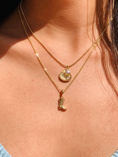 "The ultimate gift necklace for the Coastal or Western cowgirl. 2mm Gold Filled beaded necklace or Cable chain with your choice of a cowgirl boot or seashell charm necklace. Want both charms combined? Select Option 3 at checkout. Material: 18 Karat Gold Filled, Hypoallergenic. Tarnish Resistant. Gold-filled does not de-laminate or peel like Gold plated Jewelry nor does it tarnish as readily as silver. Generally speaking, gold filled is better quality and will have a much longer lasting color tha Coastal Cowgirl Gifts, Cowboy Boot Jewelry, Coastal Cowgirl Jewelry, Coastal Necklaces, Coastal Cowgirl Hat, Seashell Charm Necklace, Western Jewelry Necklace, Cowboy Boot Necklace, Cowgirl Necklace