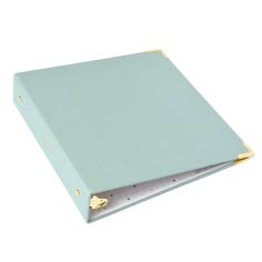 a light blue binder with gold trim