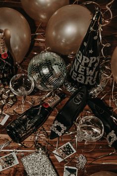 party supplies and balloons on a wooden table