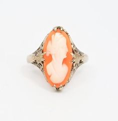 Gorgeous vintage cameo ring claw-set in solid 14k white gold filigree. Detail extends down the shoulders. Stunning!N-S Face measurement, including frame: 18 mmSize 5 - 5.25 Band falls at just over 5.25, but with the long face, it will likely "fit" slightly smallerVery good condition. Light wear.Includes featured ring only. We have lots more beautiful cameos (pins, necklaces, and earrings) available in our store... https://www.etsy.com/shop/MyMenagerieVintage💙We are pleased to say that we purcha Vintage Carved White Gold Jewelry, Fine Jewelry Cameo Wedding Ring, Fine Jewelry Cameo Rings For Weddings, Formal Oval Carved Filigree Ring, Antique 14k White Gold Jewelry, Fine Carved Jewelry For Weddings, Carved Fine Jewelry For Wedding, Oval Carved Jewelry For Wedding, Carved Fine Jewelry For Weddings