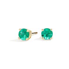 Solitaire Emerald Stud Ears - 18K Yellow Gold. These striking earrings feature deeply hued emeralds secured in classic four-prong basket settings with comfortable push back posts for pierced ears. Classic Emerald Earrings With Prong Setting, Classic Round Cut Emerald Earrings, Fortune Wheel, Emerald Stud Earrings, White Gold Studs, Yellow Gold Solitaire, Emerald Earrings Studs, Jewelry Diamonds, Accessories Jewelry Earrings