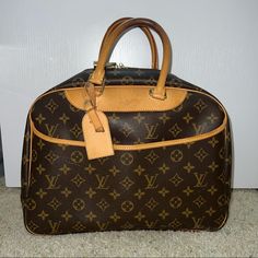 Authentic Louis Vuitton Bag Condition: Like New, Never Used Fast Delivery Luxury Top Handle Travel Bag For Errands, Luxury Travel Bag With Top Handle For Errands, Luxury Satchel Travel Bag For Errands, Luxury Monogram Canvas Satchel For Travel, Luxury Brown Luggage With Dust Bag Included, Luxury Rectangular Luggage With Handles, Designer Shoulder Bag With Luggage Sleeve For Shopping, Rectangular Monogram Canvas Bag With Luggage Sleeve, Monogram Canvas Tote Travel Bag