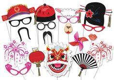 an assortment of masks and props for a chinese new year's eve photo booth