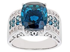 Pre-Owned 6.16ct rectangular cushion and .51ctw round London blue topaz with .27ctw round white zircon, rhodium over sterling silver ring. Measures approximately .80"L x .47"W. Not sizeable. Finished under gallery..  This product may be a customer return, vendor sample, or on-air display and is not in its originally manufactured condition.  It may not be new.  In some instances, these items are repackaged by JTV. Elegant Topaz Ring With Pave Setting For Formal Occasions, Elegant Cushion Cut Topaz Ring With Accent Stones, Luxury Cushion Cut Topaz Jewelry, Blue Topaz Jewelry With Pave Setting For Anniversary, Formal Cushion Cut Topaz Ring With Gemstone Accents, Cushion Cut Topaz Jewelry With Center Stone, Fine Jewelry Cushion-cut Topaz Ring With Gemstone Accents, Fine Jewelry Cushion Cut Topaz Ring With Gemstone Accents, Elegant Cushion Cut Topaz Ring With Gemstone Accents