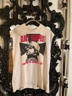 Glory Stomper Movie Shirt 1994 Vintage Something Weird Production Promo Tshirt 1960s Biker Flick T-Shirt Dennis Hopper Tee Vintage 1994 Glory Stomper 60s Exploitation B-Movie promo shirt from Something Weird Video production company. Shirt is very well broken in, butter soft and sleeveless. There is a tiny dot mark on front of shirt (see pics). Print has nicely aged with fading. Printed on a single needle shirt Fruit of The Loom, 100% cotton size XL and made in USA. Vintage Sleeveless T-shirt With Graphic Print, Vintage Sleeveless Top With Letter Print, Vintage Print Band Merch Crew Neck Top, Vintage Muscle Tee With Crew Neck For Streetwear, Retro Cotton Muscle Tee With Graphic Print, Vintage Sleeveless Cotton T-shirt, Vintage Graphic Print Muscle Tee With Crew Neck, Vintage Cotton Muscle Tee With Graphic Print, Vintage Cotton Muscle Tee With Crew Neck