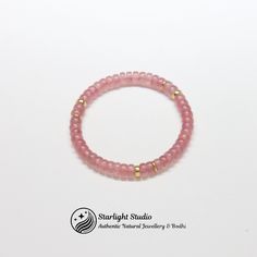 Strawberry Pink Crystal Bracelet - Elegant Handmade Jewelry Embrace the gentle elegance and subtle charm of our Strawberry Pink Crystal Bracelet. Handcrafted with love and attention to detail, this exquisite piece is perfect for adding a touch of sophistication to any outfit. Dimensions: Bead Width: 5.5mm (0.22 inches) Features: Vibrant Strawberry Pink Crystals: Each bracelet is adorned with high-quality strawberry pink crystals that catch the light beautifully, creating a soft, radiant glow. Elegant Design: The delicate design ensures it can be worn alone for a minimalist look or stacked with other bracelets for a more statement style. Why You'll Love It: This Strawberry Pink Crystal Bracelet is more than just an accessory; it's a piece that brings joy and elegance to your everyday life. Minimalist Pink Round Bracelet, Stackable Rose Gold Beaded Bracelets, Rose Gold Stackable Beaded Bracelets, Elegant Pink Stretch Bracelet For Everyday, Dainty Pink Round Bracelet, Delicate Pink Round Bracelets, Classic Adjustable Pink Bracelets, Elegant Pink Stackable Stretch Bracelet, Minimalist Single Strand Round Bracelet