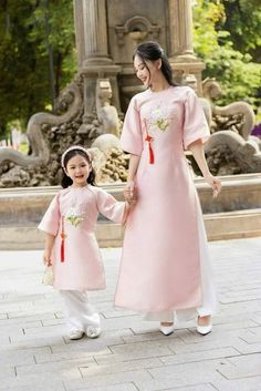 "🌿 This set includes traditional Ao Dai, pants For Girls Style: Traditional Material: Very well made with high-quality silk Collar: crew collar Please provide bust-waist-and hip measurements when placing your order to ensure the best fit for you. 🌿 NOTE: * Recommend gentle washing * Please contact us for any inquiries about size. We don't have an exchange policy for the wrong size * It is safe for a washer and dryer in a \"delicate\" setting. * Actual Ao Dai colors may differ up to 10% due to lightning and viewing devices. * These ao dai pants are made based on Vietnamese size; they will run smaller than American size. *3D printed ao dai: you may see some white broken fabric around the seam (collar). *There might be some chalk/ pen writings on the fabric because it is brand new, unwashed Spring Wedding Matching Sets, Embroidered Sets For Spring Traditional Ceremonies, Traditional Short Sleeve Sets For Spring, Traditional Short Sleeve Spring Sets, Traditional Ceremonial Sets For Spring, Elegant Sets For Traditional Ceremonies In Spring, Spring Long Sleeve Sets For Traditional Ceremonies, Traditional Pink Ceremony Sets, Pink Ceremony Sets For Eid