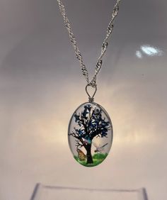 "A stunning recycled 925 sterling silver wave necklace 20\" long with handmade transparent resin pendant with delicate vinyl printed tree details and a dried flower to represent the leaves on the tree,  wrapped with sterling silver wire.  There are additional colour options for the leaves (the dried flower) blue, green, purple, red, white and yellow. Please select your chosen colour from the drop down option.  Each necklace comes in a black gift box. Every item I make is handmade with care and love and May differ slightly from the photo" Artistic Clear Jewelry For Gifts, Oval Clear Jewelry Gift, Oval Clear Jewelry For Gifts, Silver Nature-inspired Jewelry With Pressed Flowers, Nature-inspired Silver Jewelry With Pressed Flowers, Oval Silver Necklace With Pressed Flowers, Nature-inspired Silver Resin Jewelry, Oval Resin Jewelry As Gift, Oval Resin Jewelry Gift