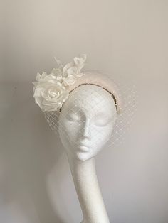 Ivory white halo crown hat Ivory white halo crown hat is made from beautiful felt fabric. In the front of the headband is matching colour netting. The headpiece has a white rubber band attached to secure it on your head, which you can hide behind your hair. There is a comb inside for extra security. This elegant and simple piece will fit any head size. It's timeless.... Enjoy your special day with this beautiful headpiece! Kristine xx to see more of my pieces visit my shop, please click the link Luxury White Sinamay Fascinator, Adjustable High Crown Headpiece For Wedding, Elegant White High Crown Mini Hat, White High Crown Mini Hats For Church, White Pinched Crown Hat For Party, White Hat With Structured Crown For Spring, Elegant White Hat With Structured Crown, White Pinched Crown Hat For Parties, Elegant White Hat For Vintage Events