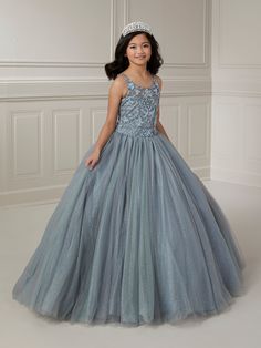 Your sweet girl will make a grand entrance in this bead embroidered long sleeveless illusion dress with A-line tulle skirt by Tiffany Princess 13723. This sleeveless gown features an illusion scoop neck sweetheart bodice with floral beaded embellishments, A-line sparkle tulle skirt, sweep train, and a lace-up back. House of Wu Tiffany Princess Collection Fall 2023 Style Number: 13723 Fabric: Floral Beading/Sparkle Tulle Please note: There may be a loss of glitter while wearing this dress due to Elegant Dresses With Illusion Neckline For Pageants, Prom Season Ball Gown With Illusion Neckline, Fitted Illusion Neckline Dress For Pageants, Sleeveless Pageant Dress With Fitted Bodice, Fitted Dresses With Illusion Neckline For Pageants, Quinceanera Tulle Dress With Illusion Neckline, Sleeveless Tulle Pageant Dress With Fitted Bodice, Sleeveless Pageant Dress With Sheer Bodice, Pageant Sleeveless Evening Dress With Fitted Bodice