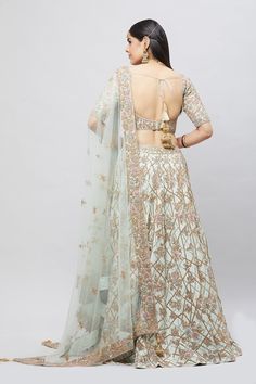 Entirely handcrafted with zardosi and crystal embroidery, this mint green lehenga is a stunner! Adorned with blush and blue resham kadhai to create a beautiful contrast! Fabric: Pure silk All preorders will be handled by a Nazranaa Bridal Consultant who will virtually discuss measurements and minor changes according to the client's specifications Occasion: Wedding Ceremony or Reception WASH CARE INSTRUCTIONS - Please Dry clean only when it is applicable. Slight color variation is possible due to Pista Green Choli With Sheer Dupatta For Reception, Reception Lehenga In Pista Green With Sheer Dupatta, Designer Pista Green Lehenga With Sheer Dupatta, Designer Pista Green Gown With Dori Work, Elegant Pista Green Choli With Dori Work, Pista Green Anarkali Embroidered Fabric For Reception, Pista Green Anarkali Set With Intricate Embroidery For Reception, Pista Green Gown With Dori Work For Reception, Pista Green Lehenga With Resham Embroidery For Reception