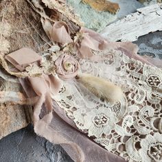 an old piece of lace with a flower on it