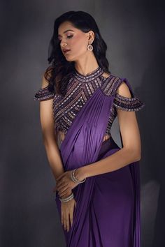 Wine pre-draped saree with embroidery details on the shoulder. Paired with a cold shoulder sequin and cutdana embroidered blouse with a back tie-up. - Aza Fashions Purple Pre-draped Saree With Cutdana For Party, Elegant Pre-draped Saree With Resham Embroidery And Cape Sleeves, Elegant Semi-stitched Pre-draped Saree With Cape Sleeves, Elegant Tops With Dupatta For Reception, Elegant Reception Tops With Dupatta, Elegant Unstitched Choli With Cape Sleeves, Semi-stitched Evening Blouse With Dupatta, Designer Pre-draped Saree With Draped Sleeves, Elegant Designer Blouse Piece With Cape Sleeves