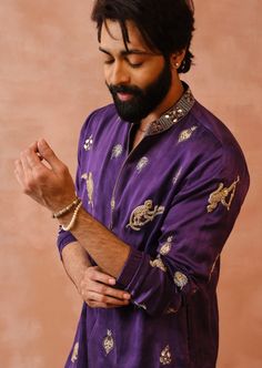 Purple satin embroidered bomber kurta with jogger pant. Disclaimer: Since we are a made-to-measure brand and our dyeing process and embroidery are handcrafted, there may be slight variations in the color and embroidery of the actual product. The print placement may also vary from what is represented in the images shown on the product page. Purple Indian Outfit, Wedding Outfits For Men, Satin Kurta, Stylish Boy Clothes, Embroidery Kurta, Indian Groom Wear, Wedding Dresses Men Indian, Payal Singhal