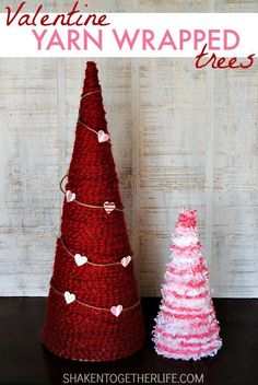 two crocheted christmas trees sitting next to each other