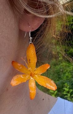 Real Crocosmia Flower Earrings, Yellow Crocosmia Epoxy Resin Earrings, Handmade Dangle Drop Earrings, Floral Earrings, Gift for Her Welcome to our shop! Discover the breathtaking beauty of these one-of-a-kind floral earrings, carefully crafted to resemble the delicate petals of a real flower. Each earring is a masterpiece of nature, meticulously preserved and transformed into a stunning piece of jewelry. Product Feature: ✿ Each pair of earrings features a about  1,5-2 inch flower of summer 2024, carefully dried and covered in non-toxic resin and attached to a silver-plated hook. Handmade in Michigan, USA.  ✿ Earrings length - about 2-2,5 inches. ✿ Our real flower earrings make the perfect gift for your sister, female friend, girlfriend, family, lover, daughter, wife, mother, and more. They Usa Earrings, Epoxy Resin Earrings, Friend Girlfriend, Real Flower Jewelry, Earrings Handmade Dangle, Gifts For Your Sister, Michigan Usa, Breathtaking Beauty, Product Feature