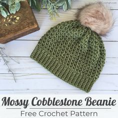 the mossy cobblestone beanie is free crochet pattern and has a faux pom - pom