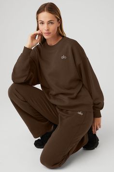 This best seller is cozy, comfortable, cute and done in classic neutrals and on-trend colors—each finished with a chrome Alo logo. It has a classic crewneck, ribbed cuffs and hem, and a laid-back dropped-shoulder fit. It’s made from midweight French terry that’s smooth on the outside and fleecy on the inside with the perfect drape. Pair with the Accolade sweatpants to make a matching set—and get one for your bestie, sibling, or partner, if you’re into that. Classic Relaxed Fit Sweats For Fall, Classic Crew Neck Sweats For Loungewear, Classic Sweatshirt With Ribbed Cuffs For Loungewear, Classic Sweats For Fall Loungewear, Classic Sweats For Loungewear In Fall, Brown Relaxed Fit Sporty Sweater, Classic Fall Sweats For Loungewear, Classic Fall Loungewear Sweats, Fall Loungewear Sweater With Ribbed Waistband