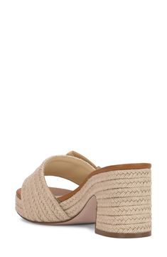 An oversized buckle details the vamp of an espadrille-inspired slide sandal lifted by a jute-wrapped platform and block heel. 3" heel; 3/4" platform Textile upper/synthetic lining/rubber sole Imported Chic Straw Mules For Spring, Natural Sandals With Stacked Heel For Vacation, Beige Open Heel Wedge Sandals For Vacation, Spring Natural Wedge Sandals With Block Heel, Spring Natural Color Wedge Sandals With Block Heel, Beach Wedge Heel Mules With Stacked Heel, Beach Mules With Stacked Wedge Heel, Beige Wedge Sandals With Stacked Heel For Spring, Natural Straw Sandals With Stacked Heel