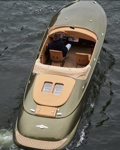 a small boat with two seats in the water