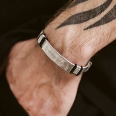 This elegant engraved bracelet for men is a stylish accessory that shows your personal touch making it one of a kind. We will engrave any name or phrase with a special meaning of your choice. This bracelet is perfect for any man, whether it's for a special occasion such as valentines day or an anniversary as a meaningful gift for a loved one. 💬 Please send us your engraving text via direct messages. 📣 Additional information about the product 👉 Material: Stainless steel 👉 Finish: Silver, Black, Silver+Black 🎁 Comes with a gift box Minimalist Stainless Steel Bracelets With Custom Name, Minimalist Stainless Steel Bracelet With Custom Name, Minimalist Stainless Steel Custom Name Bracelet, Modern Engraved Wristband For Gift, Engraved Wristband Bracelet For Friendship, Black Bracelets With Engraving Option, Personalized Stainless Steel Promise Bracelet, Engraved Stainless Steel Bracelets For Promise, Engraved Stainless Steel Promise Bracelets