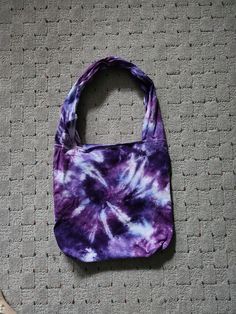 Light, medium and dark purple tie dyed bag. Measures 25 inches from bottom of bag to top of handle.  Bag is 14 inches wide. 2 small pockets are on the inside of the bag.  Item is hand dyed with procion dye and has been prewashed but I still recommend washing separately the first time.    Colors appear differently in different lighting and with different computer monitors. Purple Tote Bag For Everyday Use, Handmade Purple Tote Shoulder Bag, Purple Everyday Tote Bag, Everyday Hand Dyed Cotton Bags, Rectangular Tie Dye Bag For Everyday Use, Tie Dye Rectangular Bag For Everyday Use, Purple Rectangular Hobo Bag For Daily Use, Hand Dyed Rectangular Bags For Daily Use, Rectangular Tie-dye Bag For Daily Use