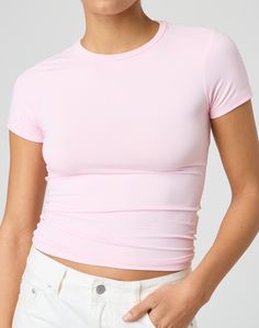 This jersey style t-shirt features supersoft material, short sleeves and a long line length. Pink Short Sleeve Top In Elastane, Pink Short Sleeve Elastane Top, Fitted Pink Short Sleeve T-shirt, Trendy Solid Color Elastane T-shirt, Fitted Short Sleeve T-shirt For Spring, Basic Short Sleeve Tops For Layering, Trendy Solid Color T-shirt With Shirttail Hem, Casual Short Sleeve Top For Summer, Casual Short Sleeve Summer Top