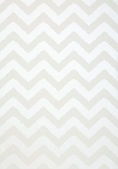 a white and gray chevroned wallpaper pattern