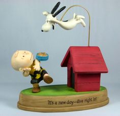 a figurine with a dog and a house