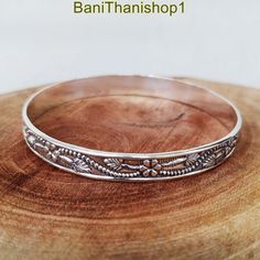 Flower Bangle,Bohemian Stacking Bangles, Nature Jewelry, Woodland Jewelry,Silver Twist Bangle,Solid 925 Sterling Silver Gift For Her,Bangle, Handmade item Delivery from a small business in India Materials: Silver,  Style: Boho & hippie Can be personalised Jewelry Details: PRODUCT-DETAIL:- Welcome to our shop: https://banithanishop1.etsy.com Best Gift For Loved One, Anniversary Gift, Birthday Gift, Engagement Gift, Wedding Gift, Gift For Sister, Gift For Wife, Gift For Mother, Occasional Gift. Me Festival Sterling Silver Bracelets, Sterling Silver Festival Bracelets, Bohemian Adjustable Engraved Bangle, Bohemian Bangle With Silver Beads For Gift, Bohemian Engraved Cuff Bracelet Bangle, Bohemian Bangle With Silver Beads As A Gift, Bohemian Engraved Bangle Cuff Bracelet, Silver Bohemian Cuff Bracelet, Nickel-free Bohemian Bangle Cuff Bracelet