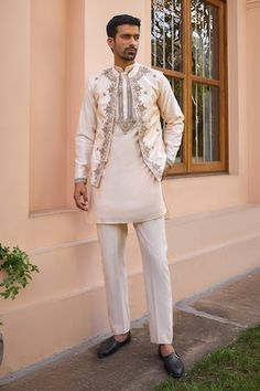 Beige bundi with marodi, dori and zardosi embroidery. Paired with a kurta and pant. - Aza Fashions Festive Designer Nehru Jacket With Dabka Work, Eid Nehru Jacket With Dabka Work, Wedding Nehru Jacket With Gota Work For Eid, Festive Raw Silk Bandhgala With Gota Work, Festival Bandhgala With Gota Work In Raw Silk, Eid Wedding Nehru Jacket With Gota Work, Wedding Eid Nehru Jacket With Gota Work, Designer Nehru Jacket With Gota Work For Eid, Festive Nehru Jacket With Dabka Work In Chanderi