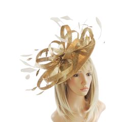 Hats By Cressida Kentucky Derby & Ascot Fascinator Hats Metallic Gold Million Dollar Sinamay & Feather Disc Fascinator Hat Beautiful metallic gold sinamay loops with gold and cream feathers on a sinamay base Fascinator body measures about 12 Inches wide Mounted with a matching headband. If you prefer a headband to match your hair, please make a note at check out what colour headband you want. Make a statement at the upcoming Kentucky Derby, Royal Ascot or Ladies Day event with our Million Dollar Elegant Gold Fitted Top Hat, Elegant Gold Top Hat For Royal Ascot, Elegant Adjustable Fascinator As A Gift, Fitted Gold Carnival Costume Hat, Elegant Fascinator With Pinched Crown For Gift, Fitted Gold Costume Hat For Carnival, Gold Wide Brim Costume Hat For Parties, Elegant Pinched Crown Fascinator Gift, Elegant Gold Top Hat For Party