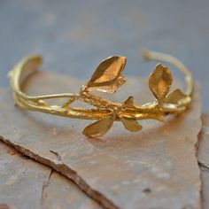 Budding Floral Bracelet Gold Leaf Nature-inspired Jewelry, Gold Leaf Botanical Jewelry, Elegant Brass Leaf Jewelry, Handmade Gold Nature-inspired Bracelets, Botanical Leaf Shaped Gold Jewelry, Botanical Style Gold Leaf Jewelry, Nature-inspired Leaf Shaped Brass Jewelry, Nature-inspired Adjustable Hand Cast Jewelry, Nature-inspired Wedding Bracelet Jewelry