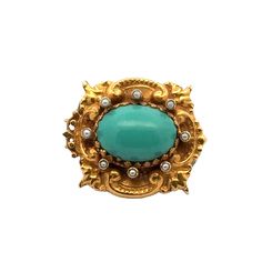 Original Art Nouveau turquoise and seed pearl brooch handcrafted in 14 karat yellow gold. The pin features a natural blue cabochon turquoise gemstone with seed pearl accents. the brooch measures 1.25 x 1.50 inches. Weight: 18 grams. Luxury Turquoise Brooches, Luxury Turquoise Brooches For Gift, Turquoise Brooch For Formal Occasions, Yellow Gold Brooch With Oval Cabochon, Elegant Turquoise Brooches For Collectors, Turquoise Cabochon Brooch As A Gift, Turquoise Cabochon Brooch For Gift, Antique Brooches, Pearl Brooch