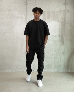 Made of 100% cotton, this heavyweight t-shirt features an oversized fit with drop shoulders. 100% Cotton Oversized fit Sizing down recommended if you prefer true to size 260 GSM Machine wash cold / hang to dry (recommended) Male model is 6'1 wearing L Male Oversized Outfit, Mens Oversized Tshirt Outfits, Oversized Black Shirt Outfit Men, Mens Oversized Button Up Shirt Outfit, Mens Black Streetwear, Man Photoshoot Poses, Male Fashion Model Poses, Black Shirt Outfit Men Aesthetic, Black Oversized Tshirt Outfit Men