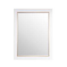 a white and gold framed mirror against a white wall with an empty space in the middle