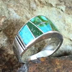 This beautiful Sterling Silver Ring showcases the spectacular Green, Blue and Yellow hues of Sonoran Gold Turquoise from Mexico.. Ring Width: 7/16"; Shank Width: 1/8" The ring is designed by David Rosales, one of the finest contemporary Southwest Artists in the world. He is the founder and co-owner of Supersmiths, Inc. of Gallup, NM. Each ring is custom made and carries a lifetime guarantee. . Artisan Multi-stone Turquoise Ring, Artisan Multi-stone Ring Jewelry, Artisan Multi-stone Ring, Turquoise Fine Jewelry Ring, Blue Opal Inlay Ring For Anniversary, Blue Opal Ring With Inlay For Anniversary, Anniversary Blue Opal Ring With Inlay, Artisan Turquoise Ring Jewelry, Turquoise Multi-stone Round Opal Ring