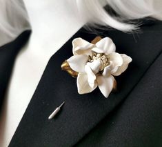 Ivory Leather Magnolia Men's Lapel Pin - Color -  Ivory, gold .  Made of genuine leather. Main flower diameter is 5 cm / 2'' (without leaves). For demonstration, a size xs mannequin is used. This item is made to order. Standard International Delivery from Latvia (Europe) via Latvijas Pasts to the U.S. usually takes about  10 - 20 business days. Thanks for looking! Floral Lapel, Flower Boutonniere, Wedding Boutonniere, Lapel Pins Mens, Floral Pins, Boutonniere Wedding, Magnolia Flower, Color Ivory, Flower Brooch