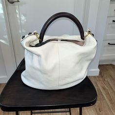 White Leather Shoulder Bag With Hard Carry Handle By J.Crew. Nwt. Approx 12” High And 14” Wide. Clip/Buckle At The Top Of The Bag To Hold It Closed. A Couple Of Small Marks On The Bottom From Storing The Bag In My Closet. White Rectangular Hobo Bag With Leather Handles, White Crossbody Hobo Bag For Daily Use, White Bucket Bag With Double Leather Handles, White Hobo Bag With Leather Handles, White Hobo Bag With Leather Handles For Travel, White Hobo Bag With Leather Handles For Everyday, White Double Handle Hobo Bag With Leather Handles, White Hobo Bag With Double Handle, White Hobo Bag With Double Handle For Daily Use