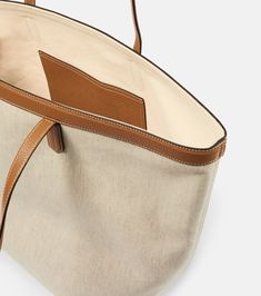 Leather-trimmed canvas tote bag in neutrals - Toteme | Mytheresa Linen Bag, Fabric Trim, Canvas Tote Bag, Fashion Styles, Womens Tote Bags, Travel Essentials, Smooth Leather, Canvas Tote, Leather Trims