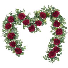 red roses and green leaves arranged in the shape of a heart on a white background