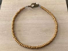 This dark gold bead bracelet features toho seed beads (size 8/0) in a striking, antique gold hue. I love the minimalist vibe to these layering pieces, and these beaded bracelets make great friendship gifts. Available in whole & half sizes, 6-9". Please ask if you have any questions. Please click below to visit my shop: https://etsy.com/shop/pepperandpomme Everyday Gold Bohemian Beaded Bracelets, Bohemian Style Gold Beaded Bracelets, Gold Heishi Beads For Gift, Gold Minimalist Hand-strung Beaded Bracelets, Brass Beaded Bracelet With Gold Beads As A Gift, Gold Beaded Bracelets With Tiny Beads For Everyday, Everyday Tiny Beads Gold Bracelets, Everyday Gold Beaded Bracelets With Tiny Beads, Spiritual Beaded Brass Bracelets