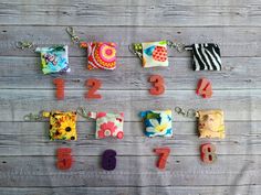 the numbers are made out of fabric and have different designs on each keychain